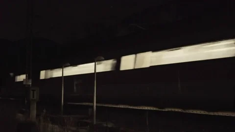 Train travels in the night Stock Footage