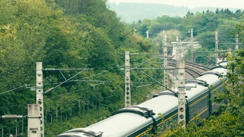 The train travels on the tracks 스톡 동영상 244304207