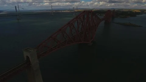 Train traversing the Firth of Forth Railway Bridge, Edinburgh, Scotland. Stock Footage 97695366
