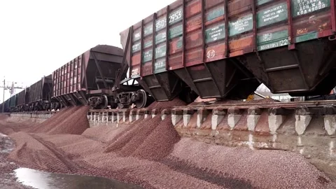 The train unloads rubble. Unloading of crushed stone at the plant. Stock Footage 196087507