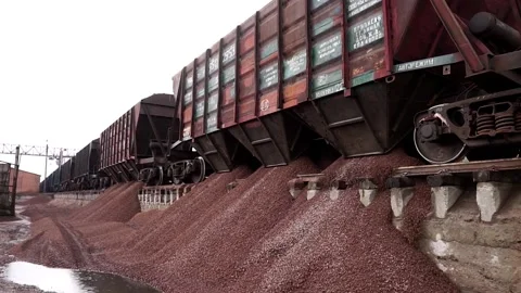 The train unloads rubble. Unloading of crushed stone at the plant. Stock Footage 196087551