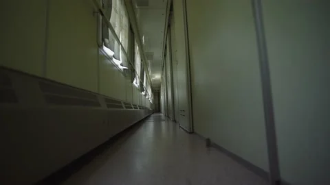 Train wagon inside. Empty train corridor with a row of closed doors. Video stock 152943384