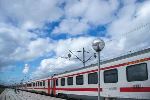 Train with wagons stopped at train station Stock Photos