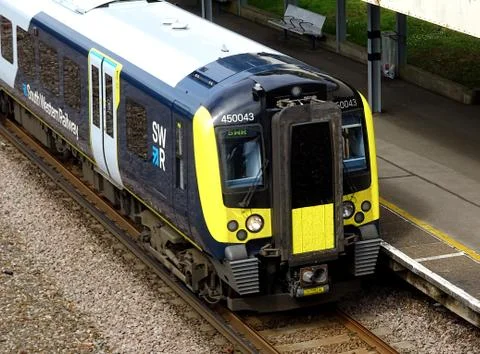 Train Waiting At The Station Platform Stock Photos