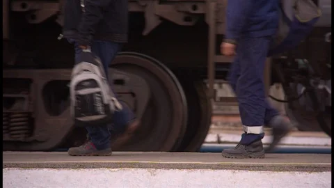 Train wheels and footsteps on the move Stock Footage 97222138