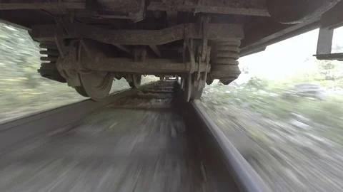Train wheels at high speed. Under old vintage train cart. Old train mechanics Stock Footage 92360017
