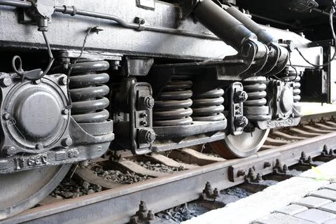 Train wheels highlight engineering power at the station Stock Photos
