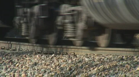 Train wheels passing by and flexing rails Stock Footage 110096