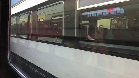 Train window to the passenger train which moves in another direction Stock Footage 74249559