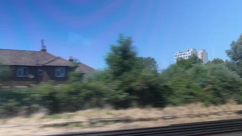Train window side view england town houses Stock Footage 92829024