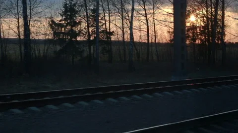 Train window view with dramatic sunset light Stock Footage 110805076