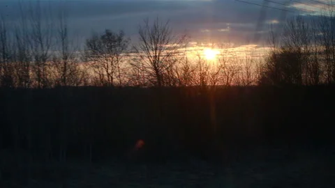 Train window view with dramatic sunset light Stock Footage 111026904