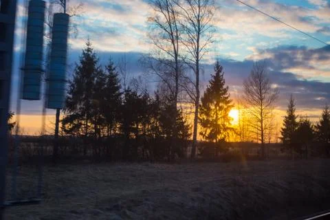 Train window view with dramatic sunset light Stock Photos