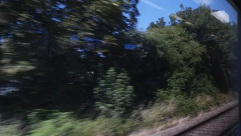 Train window view england through station Stock Footage 92829156