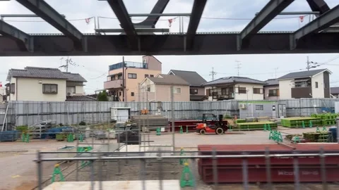 Train window view passing through modern residential area. Stock Footage 334582722