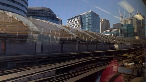 Train window view slowly entering london station Stock Footage 92829252
