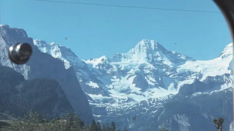 Train Window View Of Snow Capped Jungfrau Mountains Swiss Alps 1950s Stock Footage 342604592