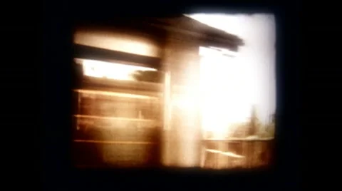 Train Window View Suburban Landscape Loop - Vintage Super8 Film Stock Footage 10562785