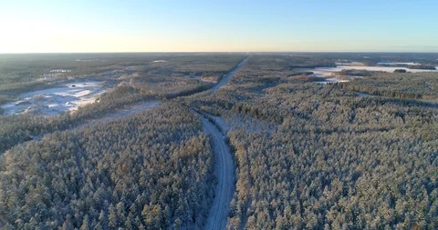 Train in winter forest, C4k aerial, reverse, drone shot, above a railway trac Stock Footage 100572058