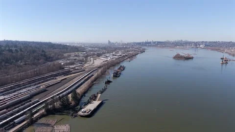 Train Yard Alongside A River In Surrey, British Columbia - Aerial Drone Shot Stock Footage 333517798