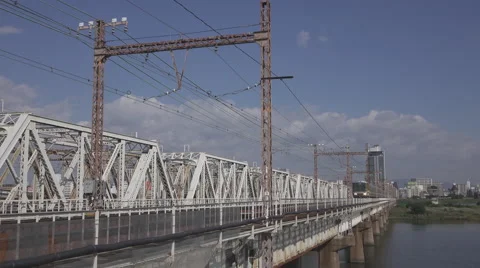 Train on Yodo River Bridge in Osaka, Japan Stock Footage 58720043