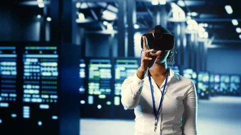 Trained admin using VR in data center 写真素材