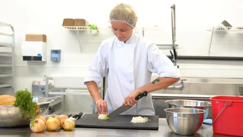 A trained chef using a proper cutting technique Stock Footage 105801454