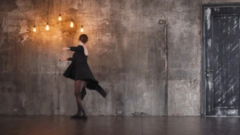 Trained dancer girl is swirling in a dramatic dance in a dark gothic hall Stock Footage 86615002