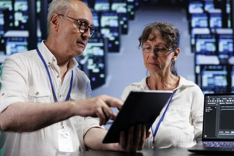 Trained wiremen doing server analysis Stock Photos