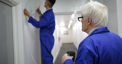 Trainee Electrician Fitting a Security Camera Stock Footage 109503646