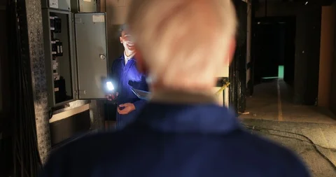 Trainee Electricians Using a Switch Board Stock Footage 109436074