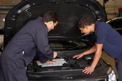 Trainee mechanic at work Stock Photos