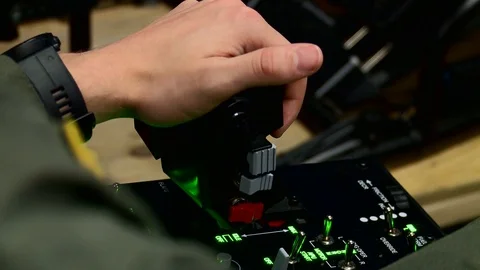 Trainee pilot operating control stick of virtual reality flight simulator Видео 103675792