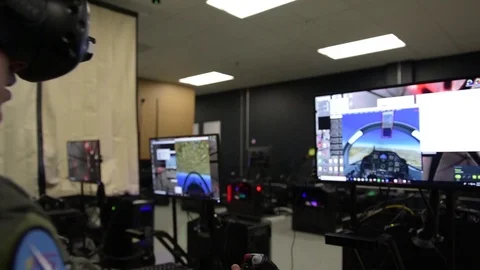 Trainee pilots using flight simulators during experimental training program Stock Footage 93447604