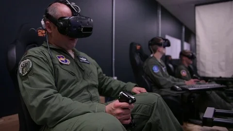 Trainee pilots using flight simulators during experimental training program Stock Footage 93447621