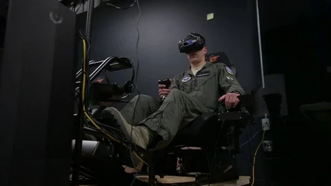 Trainee pilots using flight simulators during experimental training program Stock Footage 93447668