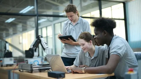 Trainee Robotics engineer learning with Programming and Manipulating Robot Ha Stock Footage 280790597