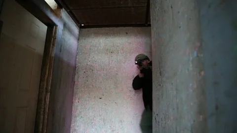 Trainees with Weapons Enter into Open Doorway Stock Footage 70561915