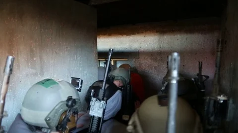 Trainees with Weapons Push Through Tight Hallway Stock Footage 70561904