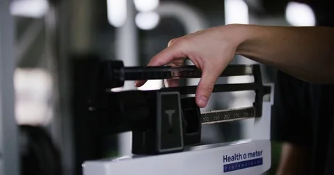 Trainer adjusting portable height measure in fitness studio 動画素材 78205629