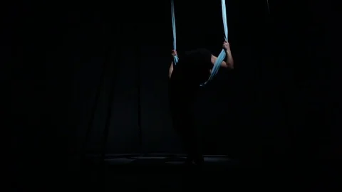 The trainer in aerial yoga shows his flexibility Stock Footage