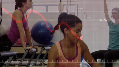 Trainer aiding client lifting knees for core, reformer moving, grid redline Stock Footage 321782866