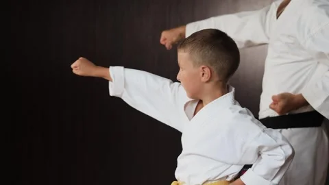 A trainer and an athlete practice straight punches Stock Footage 303433985