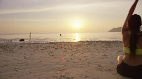 Trainer assisting couple with yoga exercise Stock Footage 75291121