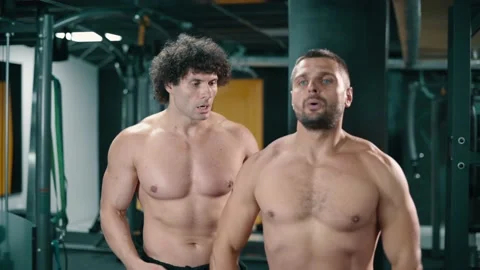 Trainer coaches client in gym. Stock Footage 164614120