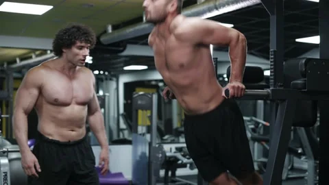 Trainer coaches client in gym. Video stock 165108102