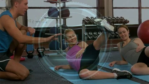 Trainer cueing two clients performing side raises to show Cyber Security HUD Stock Footage 323336561