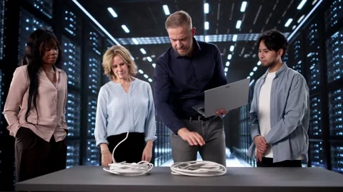 Trainer In Data Center Explaining Fiber vs Copper Cable Stock Footage 322827679