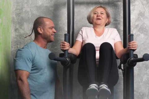 Trainer demonstrates how to properly do exercise Stock Photos