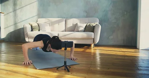 Trainer does push ups posing for camera on phone Stock-Footage 155778041